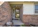 Inviting front entrance with brick accents, covered porch, and the house number prominently displayed at 617 Kokomo Ln, Indianapolis, IN 46241