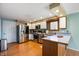 Modern kitchen with stainless steel appliances, white cabinets, and ample counter space for cooking and meal preparation at 617 Kokomo Ln, Indianapolis, IN 46241