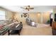 Spacious living room with carpet, natural light, and comfortable seating arrangements at 617 Kokomo Ln, Indianapolis, IN 46241