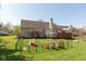 Spacious backyard featuring a lawn, patio, and play area, perfect for outdoor enjoyment at 6174 Bristlecone Dr, Fishers, IN 46038
