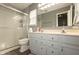 Well-lit bathroom with shower, vanity, and mirrored cabinet at 6174 Bristlecone Dr, Fishers, IN 46038