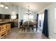 Cozy dining area featuring hardwood floors, a chandelier, and large window with natural light at 6174 Bristlecone Dr, Fishers, IN 46038