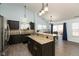 Bright dining area featuring a chandelier, hardwood floors, and sliding glass doors at 6174 Bristlecone Dr, Fishers, IN 46038