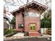Backyard featuring wood siding, stairs, and a small yard at 622 E 37Th St, Indianapolis, IN 46205