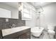 Classic bathroom with stylish vanity, decorative mirror and claw foot tub at 622 E 37Th St, Indianapolis, IN 46205