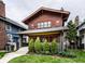 Craftsman home featuring a inviting front porch, tidy landscaping, and unique architectural details at 622 E 37Th St, Indianapolis, IN 46205