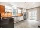 Well-lit kitchen featuring stainless steel appliances and orange backsplash at 622 E 37Th St, Indianapolis, IN 46205