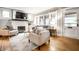 Cozy living room with fireplace, bright windows, hardwood floors, and neutral furnishings at 622 E 37Th St, Indianapolis, IN 46205