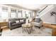 Comfortable living room with hardwood floors, bright windows, and neutral-toned seating at 622 E 37Th St, Indianapolis, IN 46205