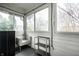Cozy sunroom with large windows and chair, creating a relaxing space to enjoy natural light at 622 E 37Th St, Indianapolis, IN 46205