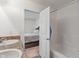 View from bathroom into the main bedroom with a shower and tub at 6316 Avacado Dr, Indianapolis, IN 46217