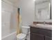 The bathroom has a matching sink and toilet with a tub and shower combination at 6316 Avacado Dr, Indianapolis, IN 46217