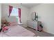 Cozy bedroom decorated with pink accents, neutral carpet, and a bright, cheerful atmosphere at 6316 Avacado Dr, Indianapolis, IN 46217