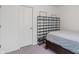 This bedroom has light purple carpet, a dark wood headboard and a black shoe rack at 6316 Avacado Dr, Indianapolis, IN 46217