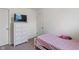 Cozy bedroom featuring a dresser with a television and a bed at 6316 Avacado Dr, Indianapolis, IN 46217