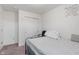 Bedroom featuring neutral carpet, a large window, and minimalist decor at 6316 Avacado Dr, Indianapolis, IN 46217