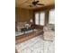 Bright living room features wood-paneled walls, neutral furniture, and natural light, creating a warm and inviting space at 6389 N Forest St, Martinsville, IN 46151