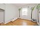 Cozy bedroom with hardwood floors, natural light, and decorative tree decals at 6436 Lakeland Blvd, Indianapolis, IN 46234
