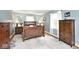 Comfortable bedroom with hardwood floors, two windows, and classic furniture at 6436 Lakeland Blvd, Indianapolis, IN 46234