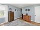 Bedroom with hardwood floors, natural light, and TV wall mount at 6436 Lakeland Blvd, Indianapolis, IN 46234