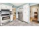 Well-equipped kitchen with stainless steel appliances and access to other rooms in the home at 6436 Lakeland Blvd, Indianapolis, IN 46234