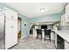 Eat-in kitchen featuring white cabinets, granite countertops, and an inviting open floor plan at 6436 Lakeland Blvd, Indianapolis, IN 46234
