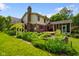 Backyard with beautiful garden and screened porch at 6761 E Woodland Ct, Mooresville, IN 46158