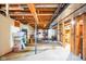 Unfinished basement with exposed ductwork, concrete floor and ample storage at 6761 E Woodland Ct, Mooresville, IN 46158