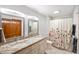Bathroom with double sinks, granite counters, tile floor and decorative shower curtain at 6761 E Woodland Ct, Mooresville, IN 46158