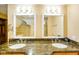Bathroom featuring dual sinks, granite counters, lots of light, and modern fixtures at 6761 E Woodland Ct, Mooresville, IN 46158