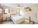 Bedroom with neutral carpet, two windows with shades, and a ceiling fan at 6761 E Woodland Ct, Mooresville, IN 46158