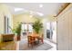 Sunny dining area with skylights, neutral colors, a ceiling fan, and access to the backyard at 6761 E Woodland Ct, Mooresville, IN 46158