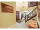 Inviting home foyer with tile flooring, wooden staircase, and decorative accents at 6761 E Woodland Ct, Mooresville, IN 46158