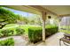 Relaxing front porch with a view of the lush, green lawn and mature trees, perfect for enjoying nature at 6761 E Woodland Ct, Mooresville, IN 46158