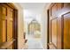 Bright hallway leads to an airy bathroom featuring a soaking tub and storage at 6761 E Woodland Ct, Mooresville, IN 46158