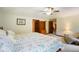 View of bedroom with open doorways, white walls, natural light and floral bedding at 6761 E Woodland Ct, Mooresville, IN 46158