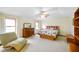 Spacious main bedroom boasts a fan and natural light from multiple windows at 6761 E Woodland Ct, Mooresville, IN 46158