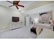 Spacious bedroom with soft lighting, a ceiling fan, and a calming color palette at 6802 Carters Grove Dr, Noblesville, IN 46062