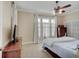 Bright bedroom featuring a ceiling fan, plantation shutters, and light-colored walls at 6802 Carters Grove Dr, Noblesville, IN 46062