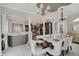 Spacious dining room featuring architectural columns, dark wood table and an open design at 6802 Carters Grove Dr, Noblesville, IN 46062