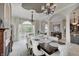 Elegant dining room with a dark wood table, pendant lighting, and large windows at 6802 Carters Grove Dr, Noblesville, IN 46062