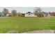 Expansive residence boasts a pristine lawn, perfectly manicured landscaping, and a classic facade at 6802 Carters Grove Dr, Noblesville, IN 46062