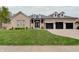Charming brick home with a well-manicured lawn and a three-car garage, perfect for Gathering living at 6802 Carters Grove Dr, Noblesville, IN 46062