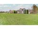Expansive residence boasts a pristine lawn, perfectly manicured landscaping, and a classic facade at 6802 Carters Grove Dr, Noblesville, IN 46062
