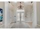 Grand foyer with soaring ceilings, chandelier, and double doors creating a welcoming entrance at 6802 Carters Grove Dr, Noblesville, IN 46062
