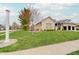 Well-maintained front yard with lush lawn and mature trees, offering great curb appeal at 6802 Carters Grove Dr, Noblesville, IN 46062