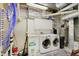 Functional laundry room equipped with modern appliances, a utility sink, and cabinet space at 6802 Carters Grove Dr, Noblesville, IN 46062