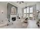 Bright living room featuring a fireplace, large windows, and comfortable seating at 6802 Carters Grove Dr, Noblesville, IN 46062