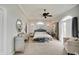 Main bedroom featuring neutral colors, sitting area, and decorative mirror at 6802 Carters Grove Dr, Noblesville, IN 46062
