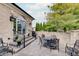 Outdoor patio featuring comfortable seating, lush greenery, and elegant brick accents for relaxed outdoor living at 6802 Carters Grove Dr, Noblesville, IN 46062
